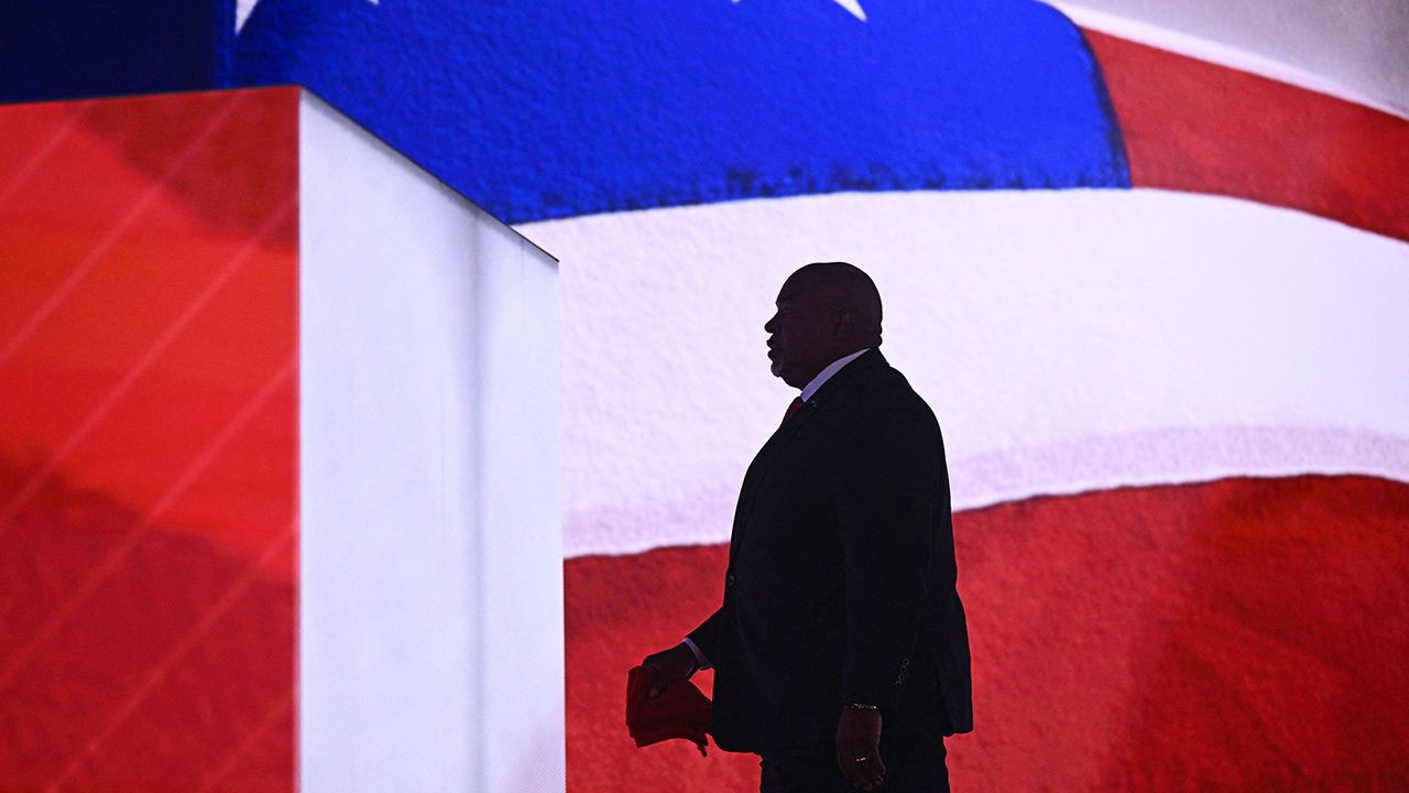 The silhouette of Lieutenant Governor of North Carolina Mark Robinson against an American flag.